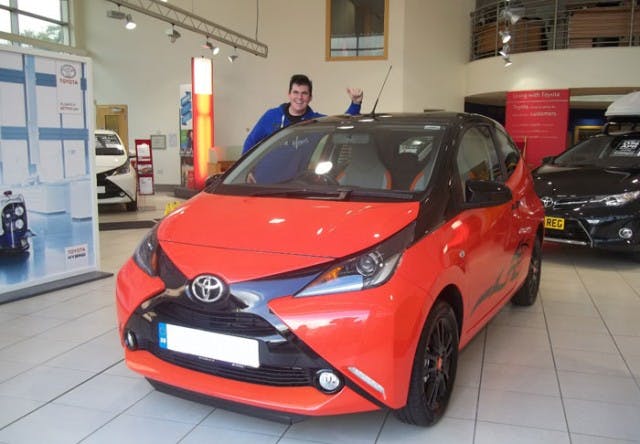 Happy Customer Takes Delivery of New AYGO X-Cite